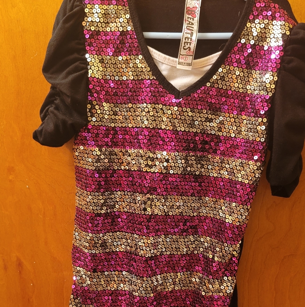 Girls M black, silver, and hot pink sequence shirt.With pinched sleeves.